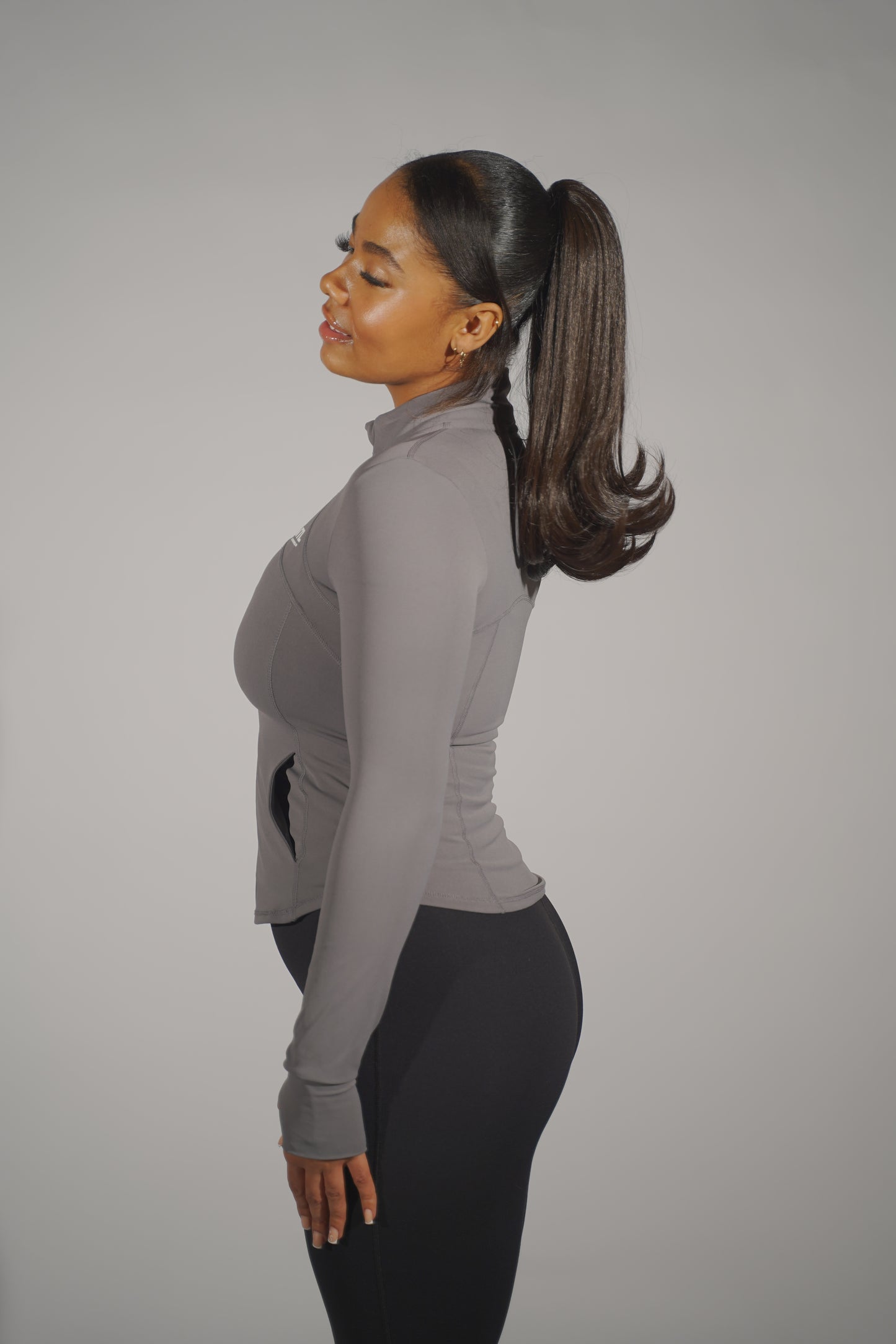 Front view of a grey contour jacket displayed on a mannequin